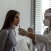 Nurse takes swa test of a girl